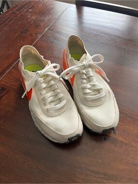 Nike White Low-Top Sneakers with Orange Swoosh and Neon Green Insole